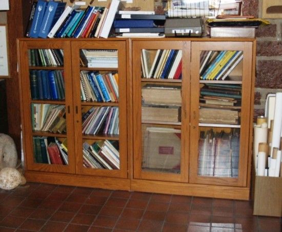 Book case housing some of the Society's book collection and original school records